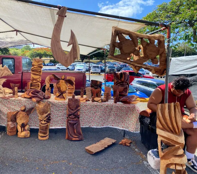 A local artist shares his woodworking skills at the Aloha Swap Meet