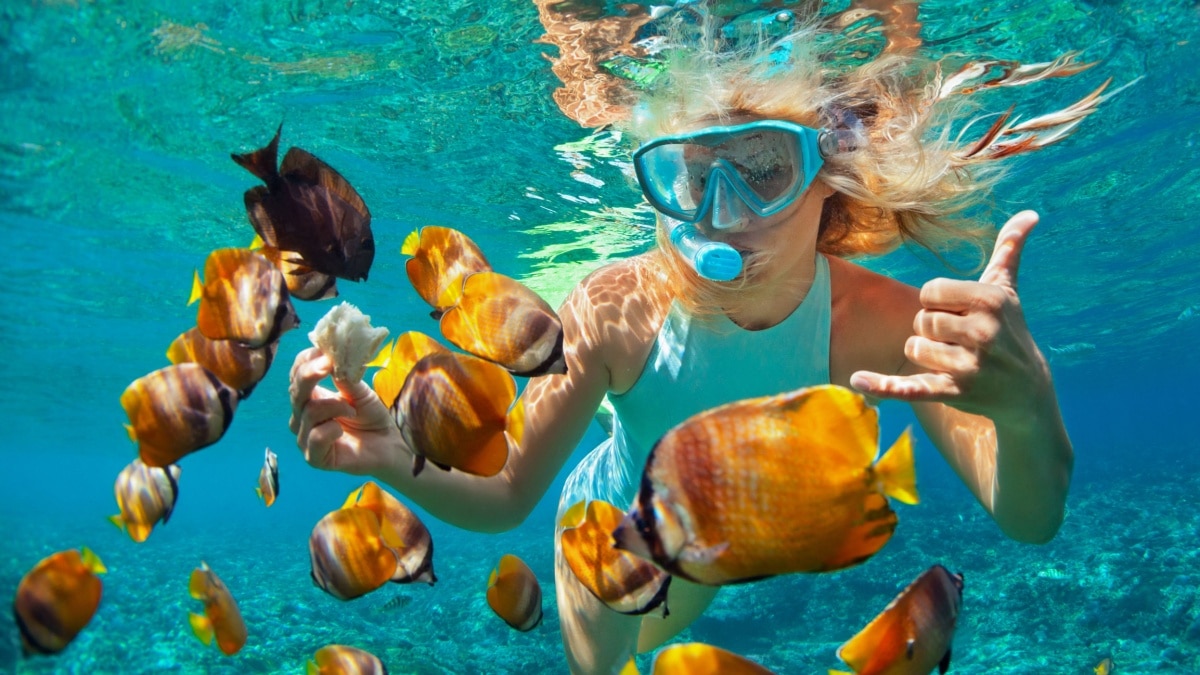 woman snorkeling hawaii