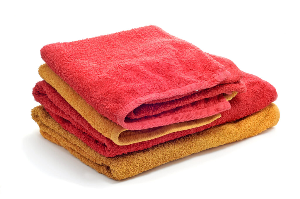 a pile of towels on a white background