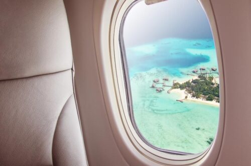 airplane window over island