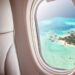 airplane window over island