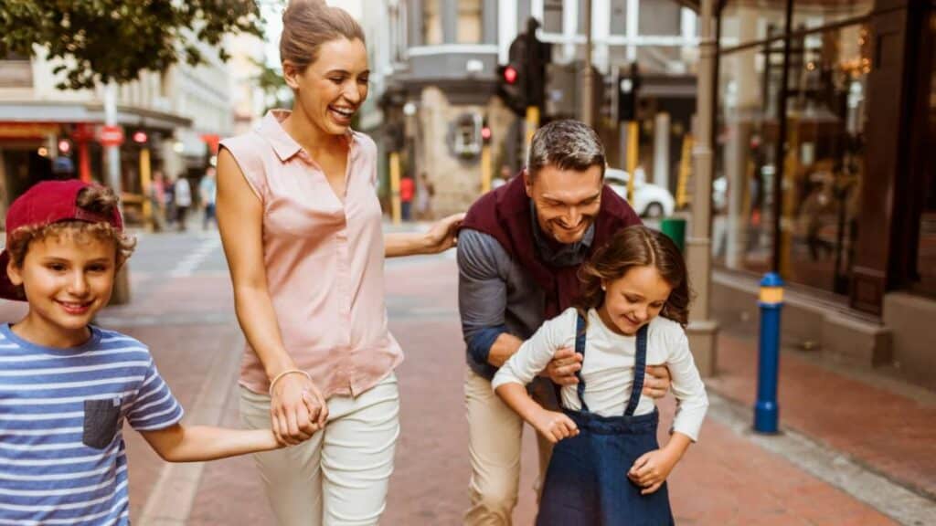 family on city sidewalk