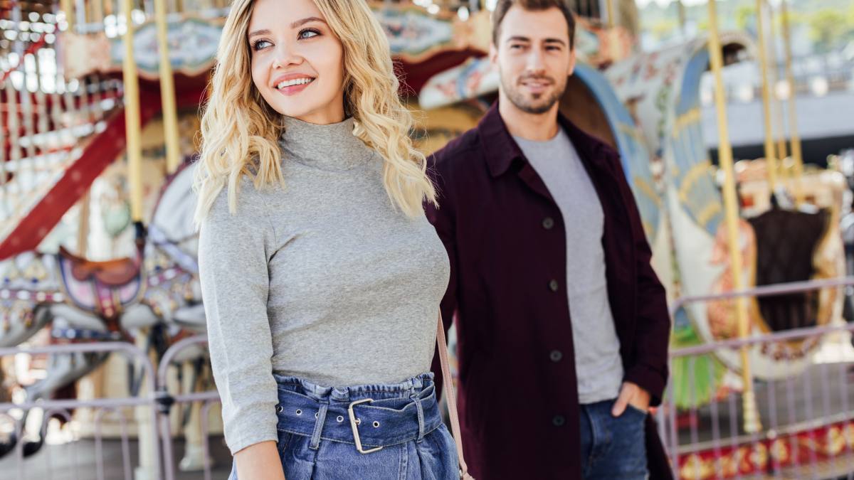 man and woman at amusement park