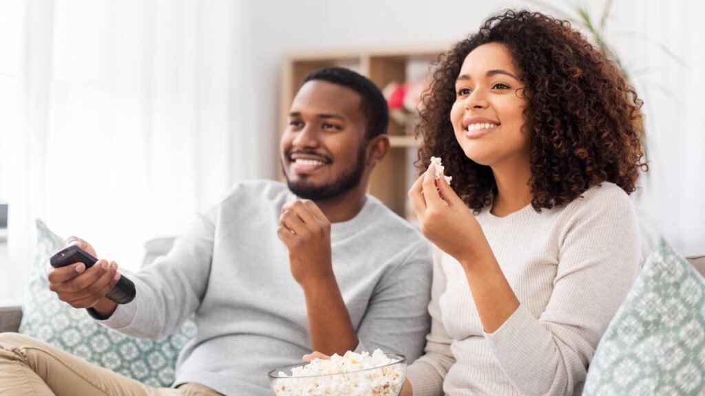 man and woman watching movie