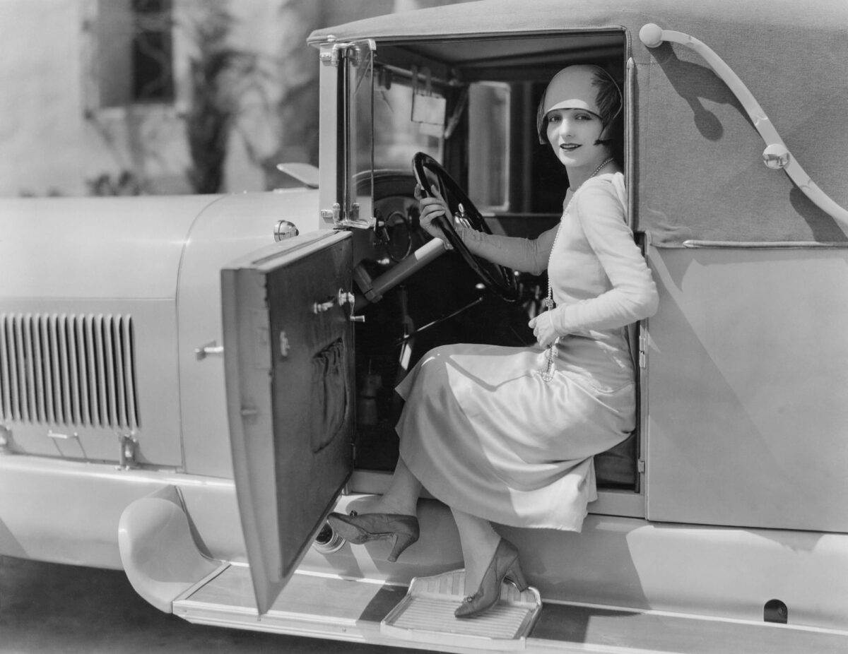 woman in a vintage car