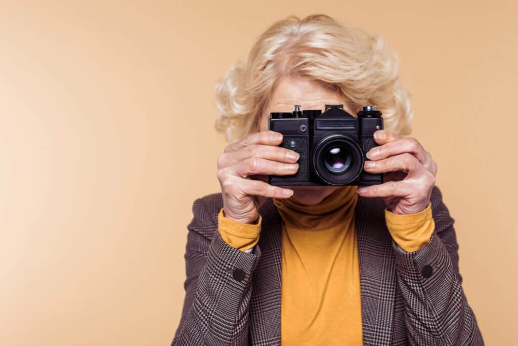 older woman taking photo