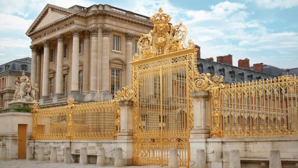 golden entry gate at Palace of Versailles