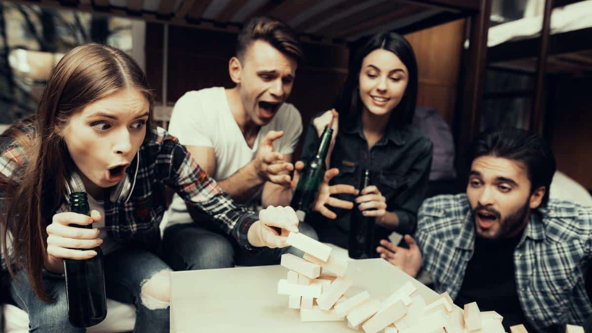 friends playing games in hotel