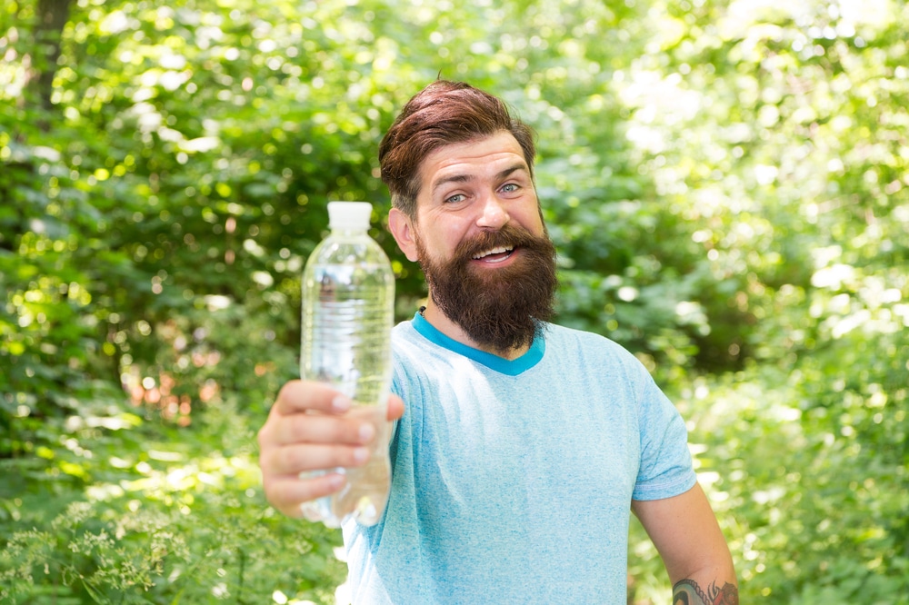 happy man drinking water
