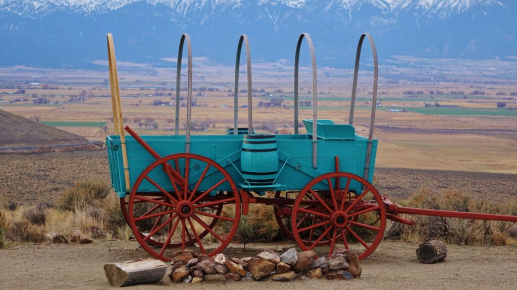 blue and red covered wagon