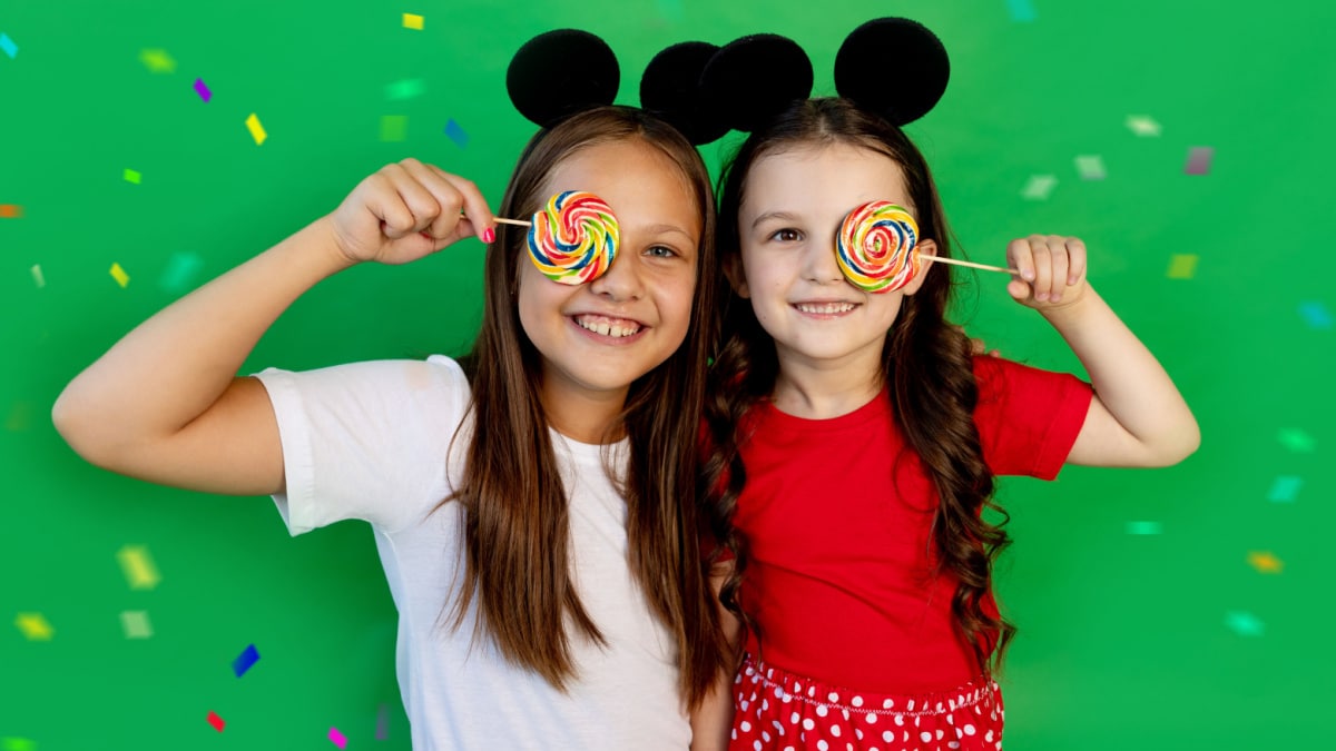 two girls with mickey mouse ears