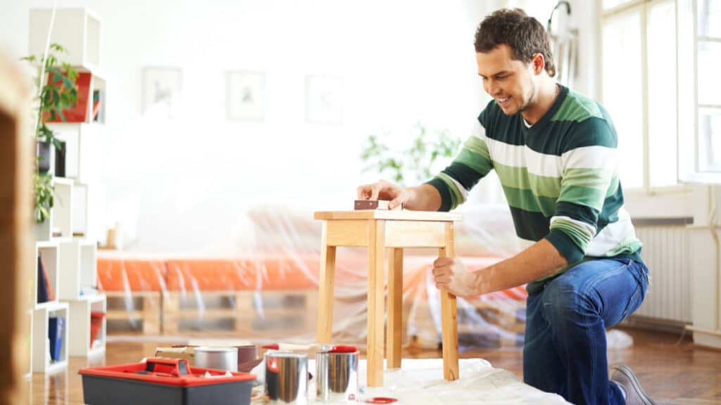 man putting furniture together