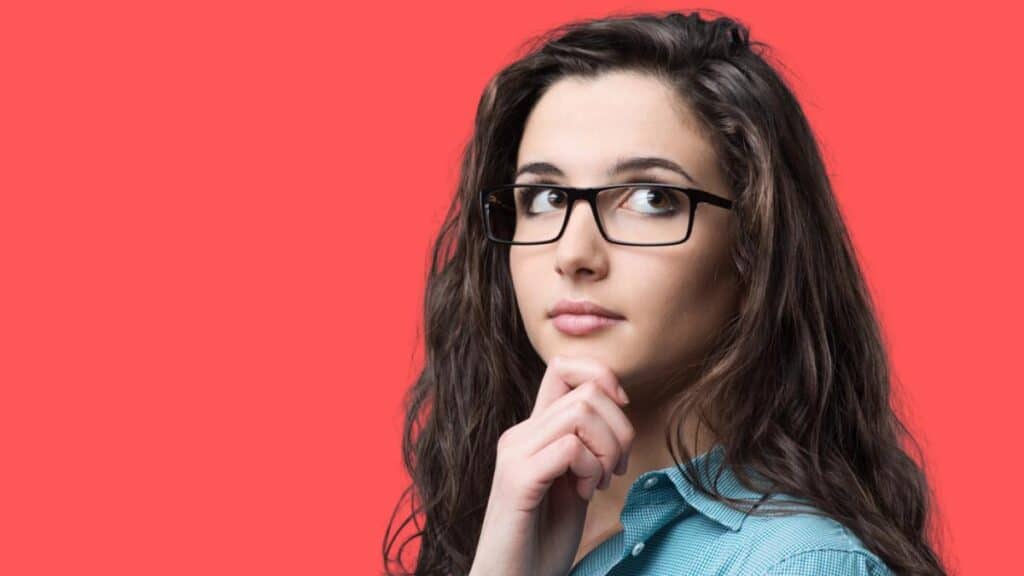smart woman thinking red background