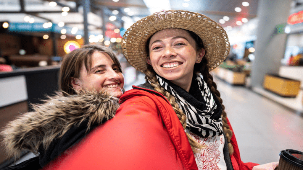 Friends taking a selfie at airport