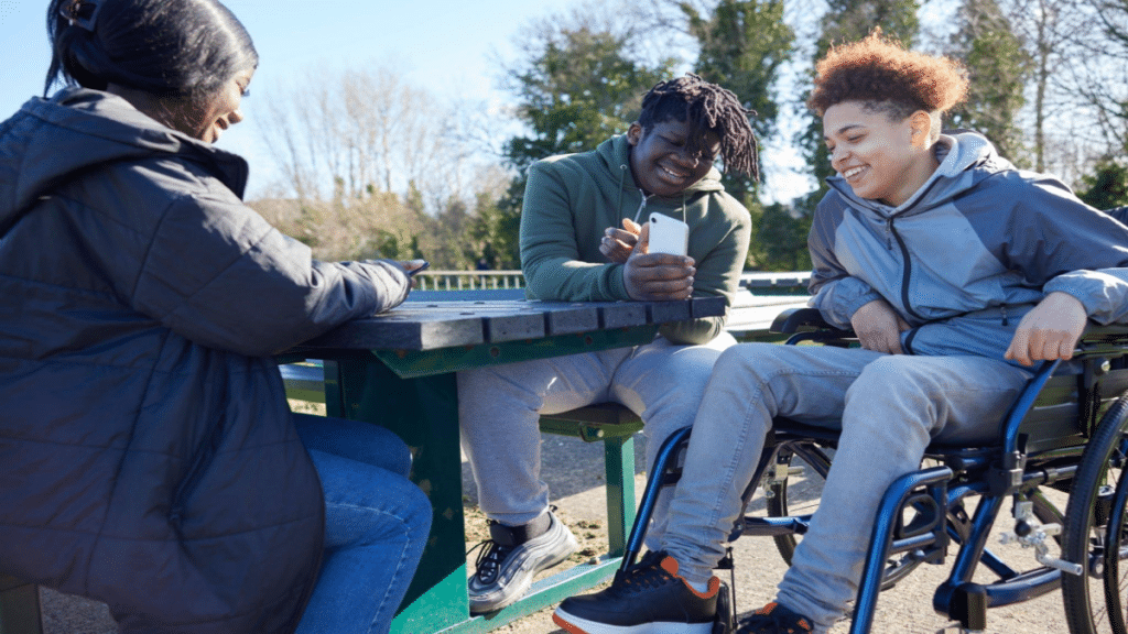 Girl In Wheelchair With Friends