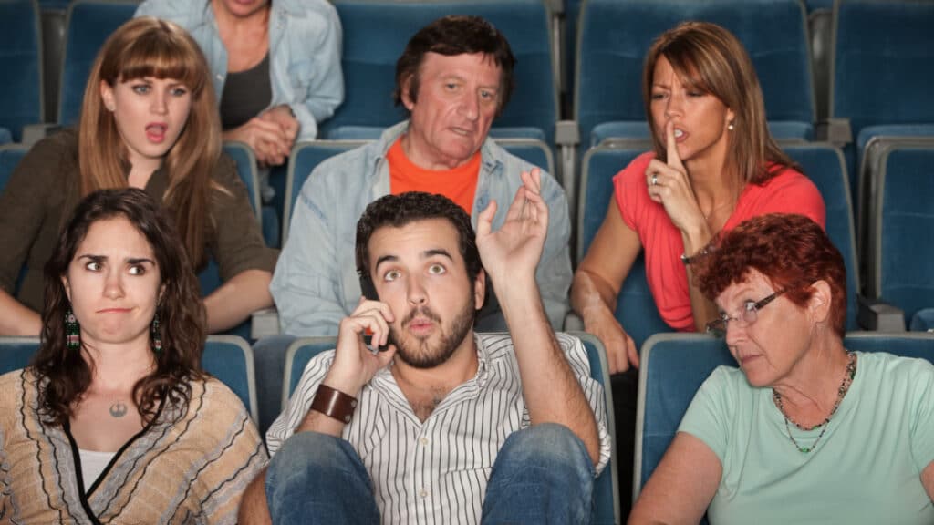 inconsiderate rude man in theater