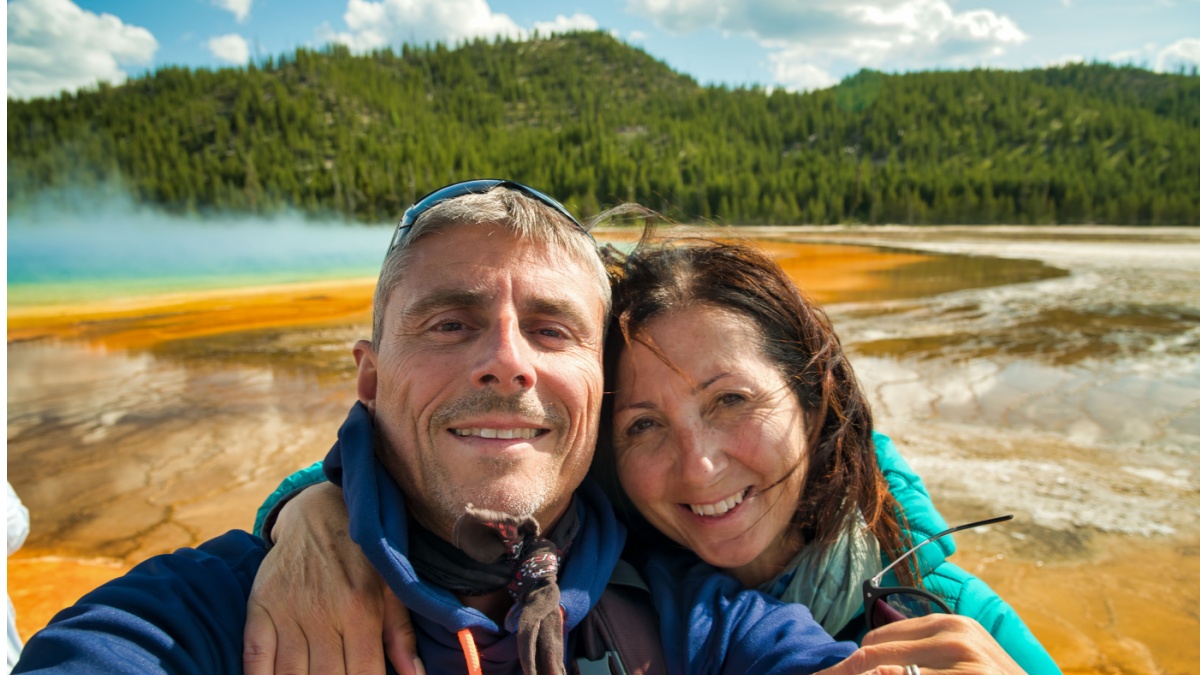 man and woman tourists at yellowstone national park