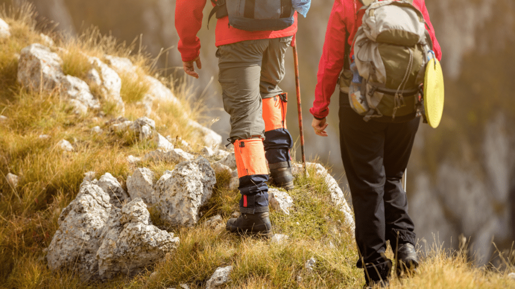 couple walking with backpacks outdoors