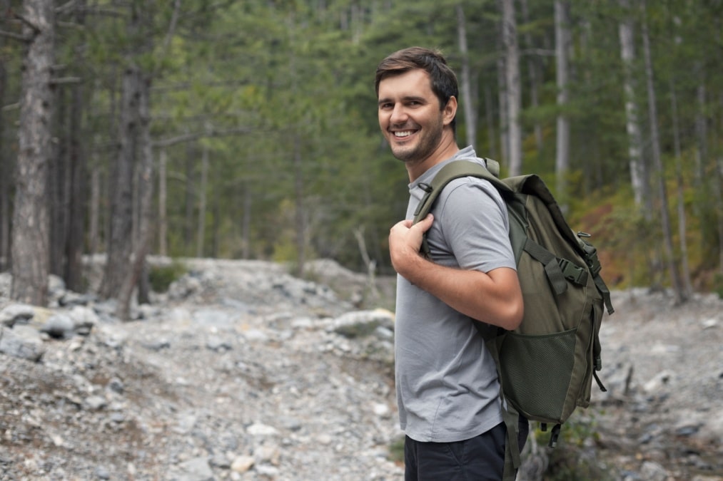 smiling man hiking